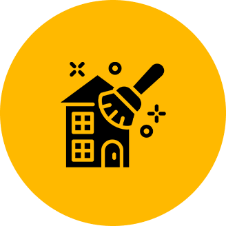 Icon of a house with a cleaning brush over it, surrounded by sparkles, on a yellow circular background.