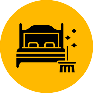 Illustration of a bed and broom inside a yellow circle, symbolizing cleaning or housekeeping services.